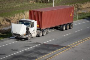 A Broken Semi Truck on the Side of the Road with its Hood Up