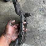 Damaged brake shield bracket needs replacing