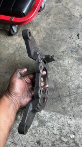 Damaged brake shield bracket needs replacing