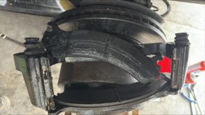 Broken brake pad in a high-mileage vehicle